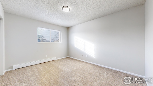 empty room with carpet, a textured ceiling, and a baseboard radiator