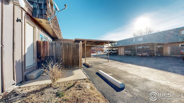 view of side of home featuring a carport