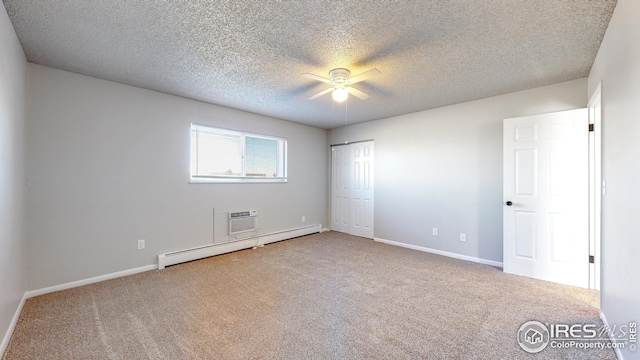 unfurnished bedroom featuring ceiling fan, baseboard heating, a textured ceiling, and carpet floors