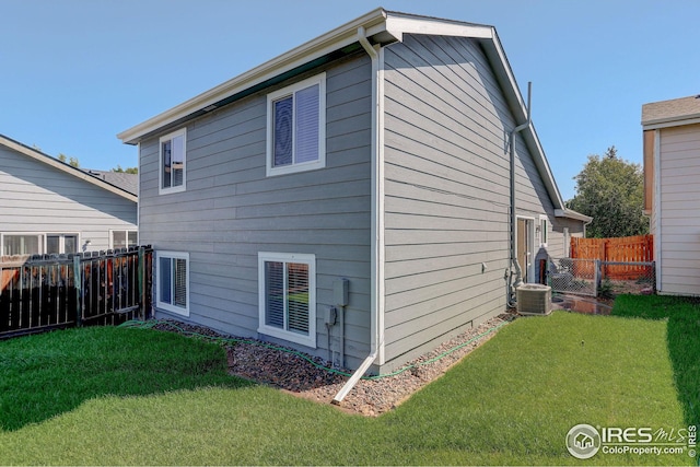 view of home's exterior with a yard