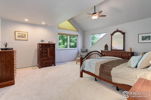 carpeted bedroom with lofted ceiling and ceiling fan