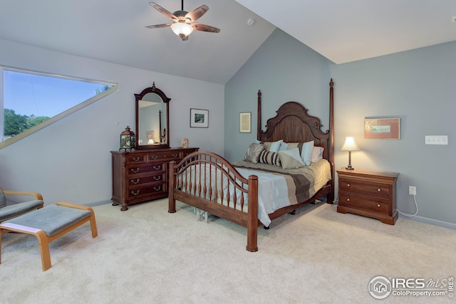 carpeted bedroom with lofted ceiling and ceiling fan