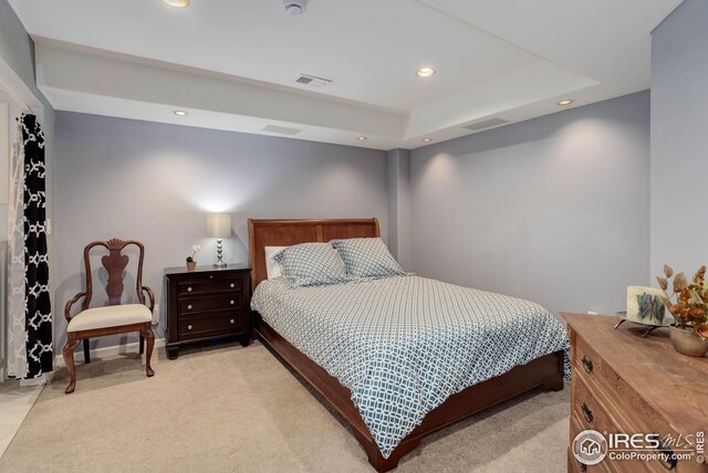 bedroom featuring light carpet