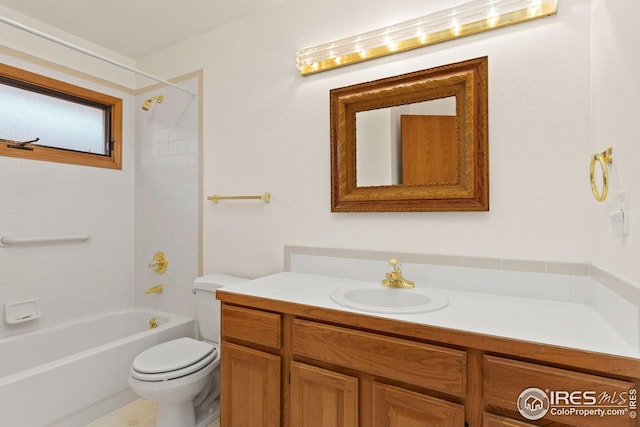 full bathroom with vanity, toilet, and tiled shower / bath combo