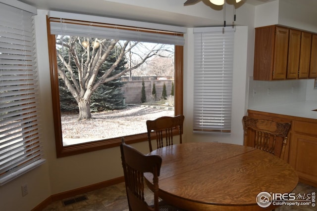 dining space featuring ceiling fan