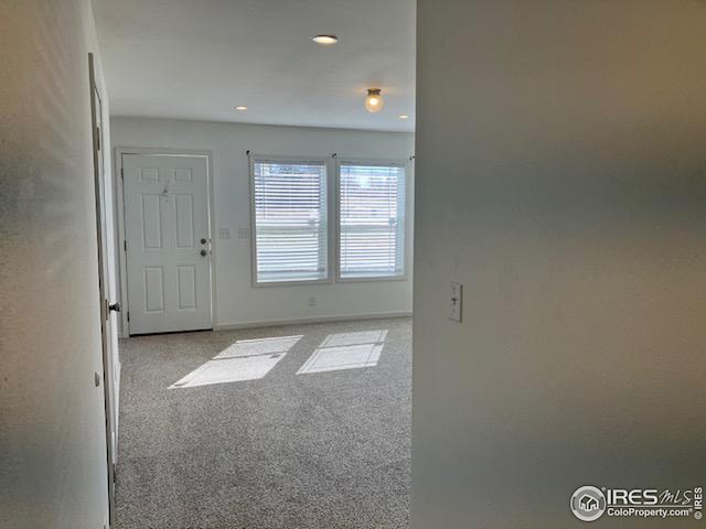 interior space with recessed lighting and baseboards