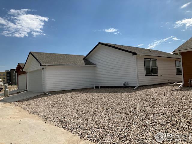 view of side of property with an attached garage