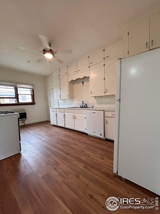 kitchen featuring white appliances, dark hardwood / wood-style flooring, ceiling fan, and white cabinets