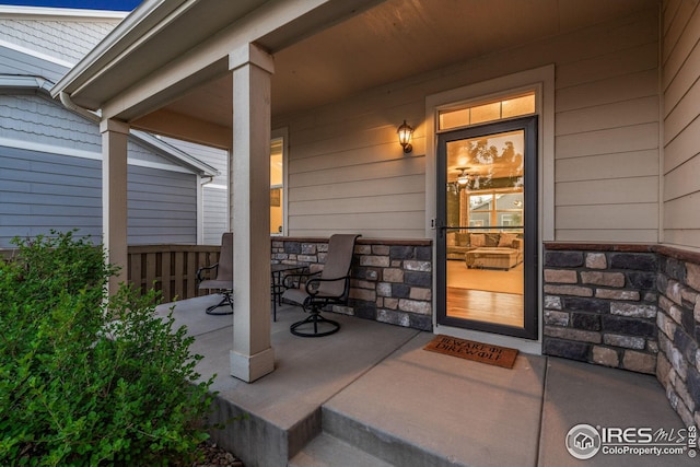 doorway to property with a porch