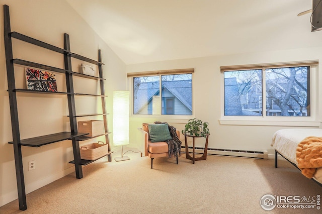 living area featuring vaulted ceiling, baseboard heating, and carpet