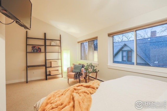 bedroom featuring lofted ceiling, baseboards, and light colored carpet