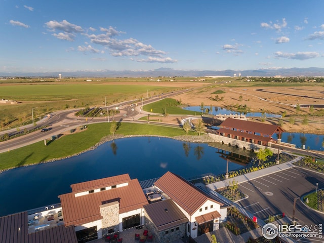 drone / aerial view featuring a water view and a rural view