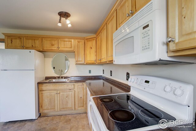 kitchen with white appliances and sink