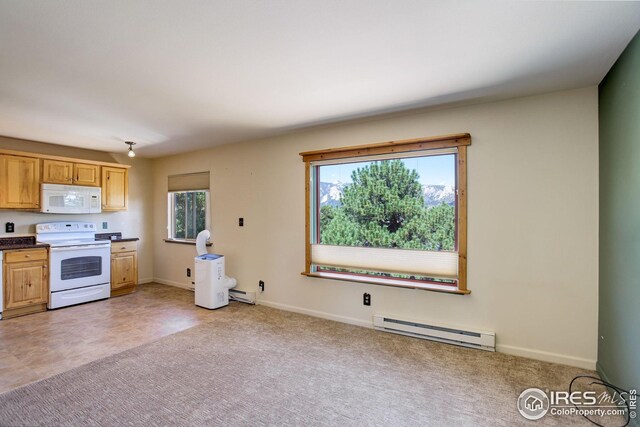 kitchen with white appliances and baseboard heating