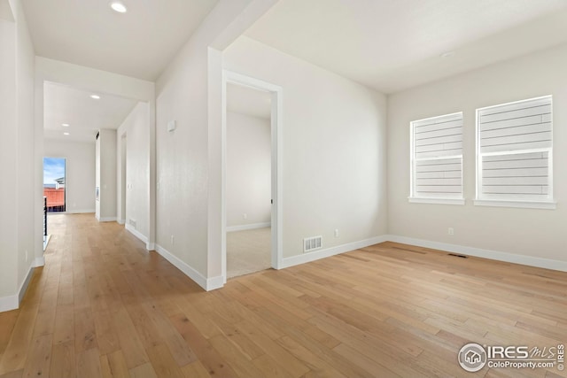 hallway with light wood-type flooring