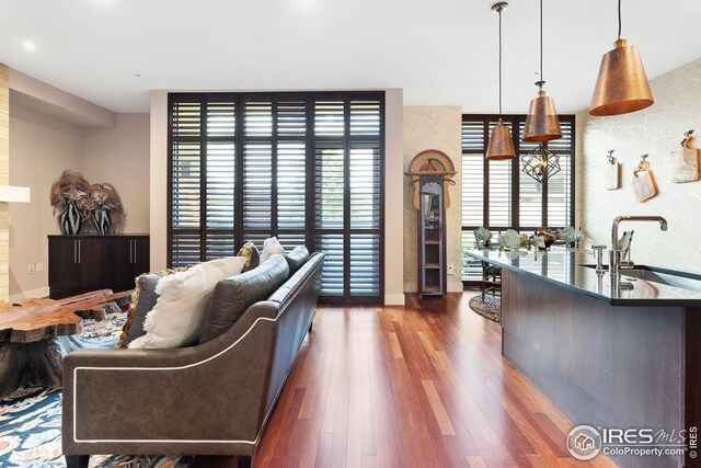 1155 Canyon Blvd Unit 205, Boulder, CO 80302 - living room with baseboards, wood finished floors, and recessed lighting