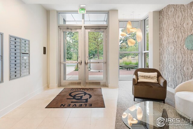 1155 Canyon Blvd Unit 205, Boulder, CO 80302 - doorway to outside featuring tile patterned floors, mail area, baseboards, and french doors