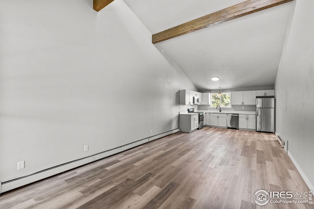 unfurnished living room featuring light wood-type flooring, lofted ceiling with beams, and a baseboard heating unit