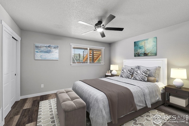 bedroom featuring ceiling fan, a textured ceiling, a closet, and dark hardwood / wood-style flooring