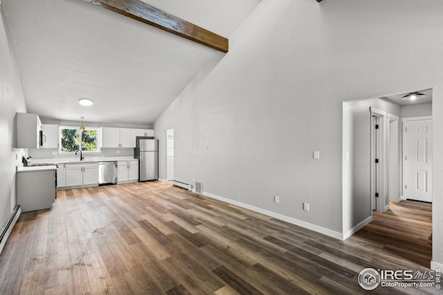 unfurnished living room with high vaulted ceiling, a textured ceiling, beamed ceiling, and hardwood / wood-style floors