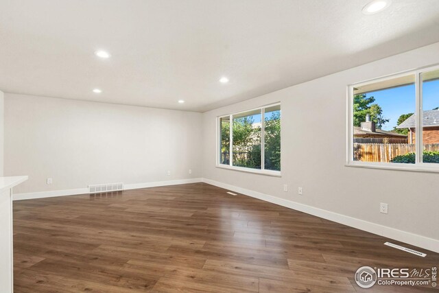 empty room featuring dark hardwood / wood-style floors