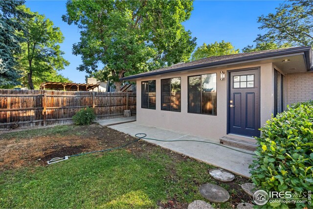 exterior space featuring a yard and a patio area