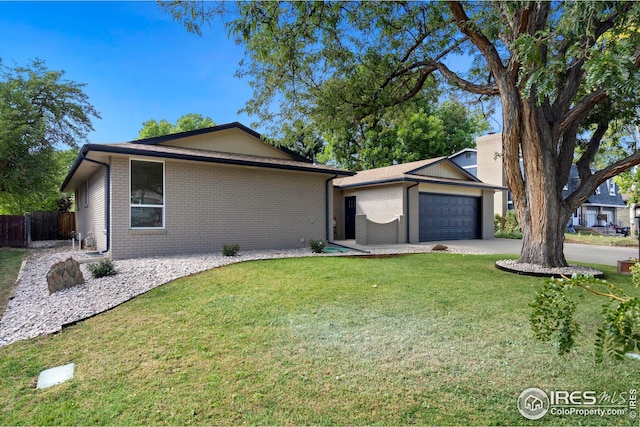 ranch-style house with a front yard and a garage