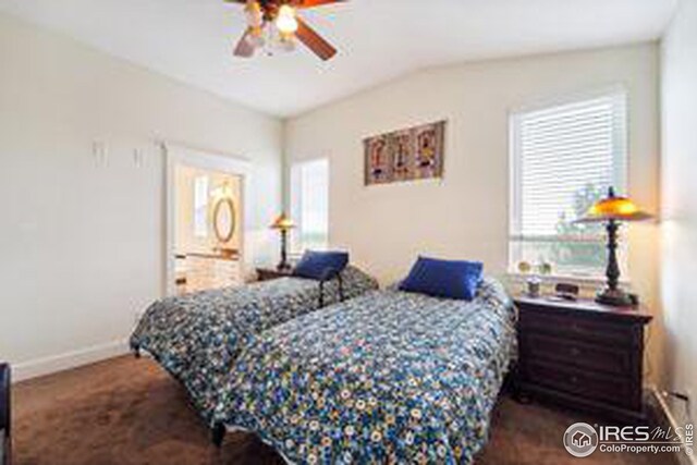 bedroom featuring ceiling fan, lofted ceiling, and dark carpet