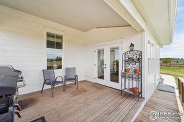 wooden deck featuring french doors