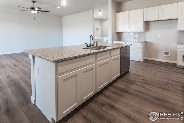 1215 105th Avenue Ct, Greeley, CO 80634 - kitchen with dishwasher, a ceiling fan, a sink, and tasteful backsplash