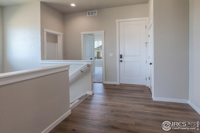 1215 105th Avenue Ct, Greeley, CO 80634 - hall with baseboards, dark wood-style flooring, visible vents, and recessed lighting