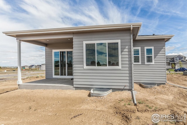1215 105th Avenue Ct, Greeley, CO 80634 - rear view of house featuring a patio area