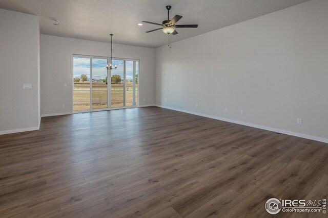 1215 105th Avenue Ct, Greeley, CO 80634 - empty room featuring ceiling fan with notable chandelier, recessed lighting, baseboards, and dark wood-type flooring