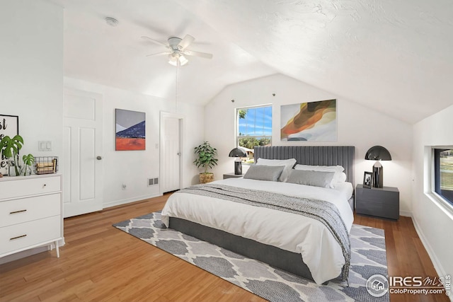 bedroom with vaulted ceiling, hardwood / wood-style floors, and ceiling fan