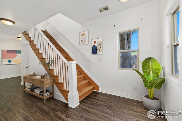 stairway featuring hardwood / wood-style flooring