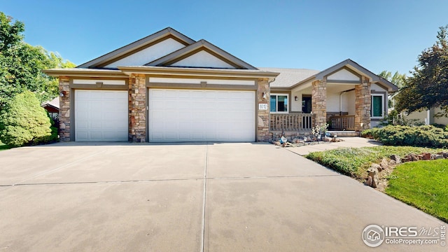 view of front of property featuring a garage and covered porch