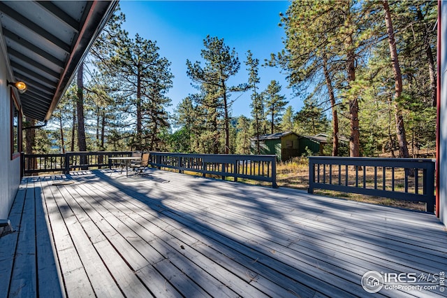 wooden deck featuring outdoor dining space