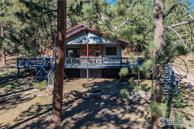 view of front of property with stairs and a deck