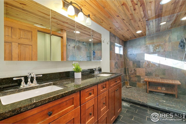 bathroom with vanity, tile walls, wooden ceiling, and tiled shower