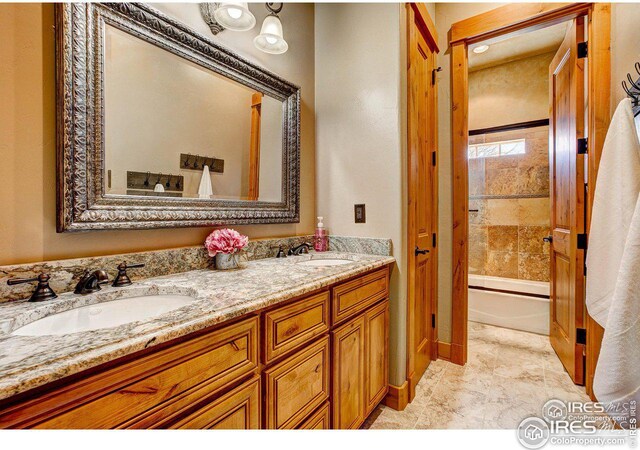 full bath with shower / bathtub combination, double vanity, and a sink