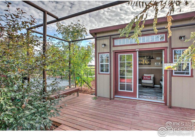 wooden deck featuring a lanai