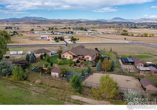 drone / aerial view with a rural view and a mountain view