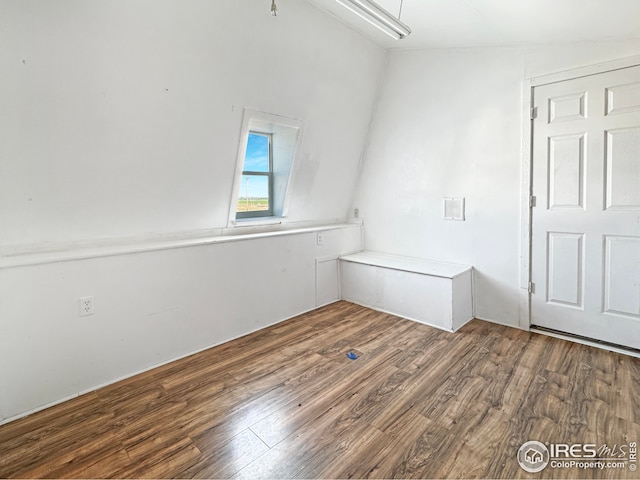 spare room featuring wood finished floors