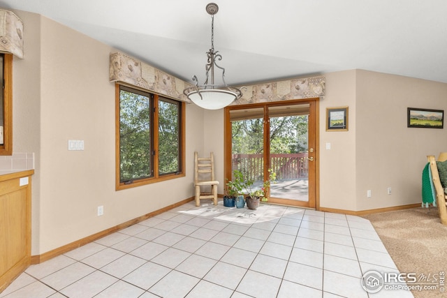 unfurnished dining area featuring light tile patterned floors