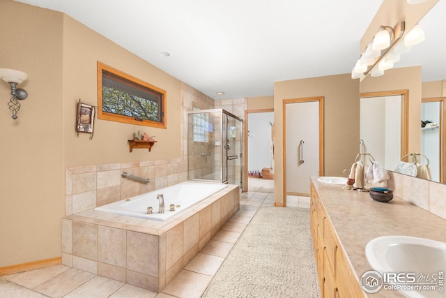 bathroom featuring tile patterned flooring, vanity, and plus walk in shower