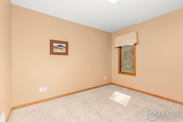 empty room featuring carpet flooring