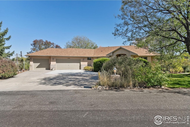 ranch-style home with a garage