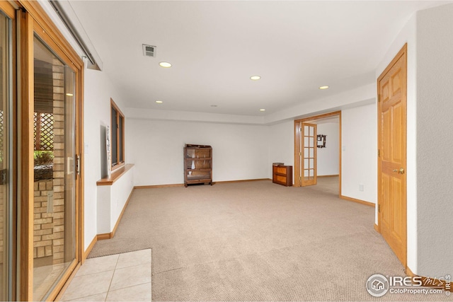 carpeted empty room with french doors