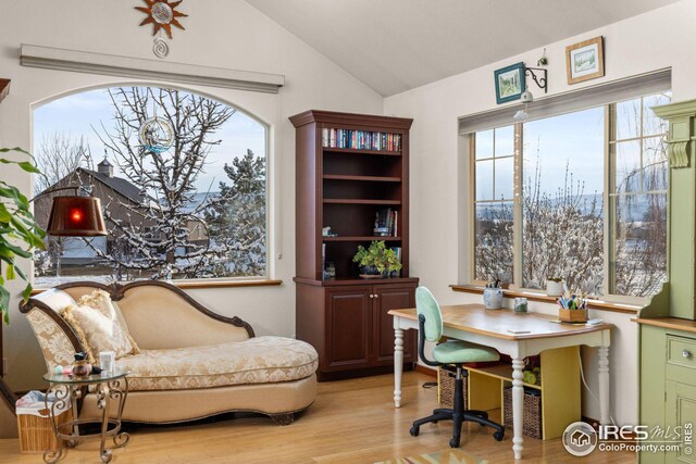 living room featuring ceiling fan, wood-type flooring, a wood stove, and ornamental molding