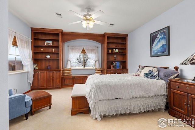 bedroom featuring ceiling fan and light colored carpet